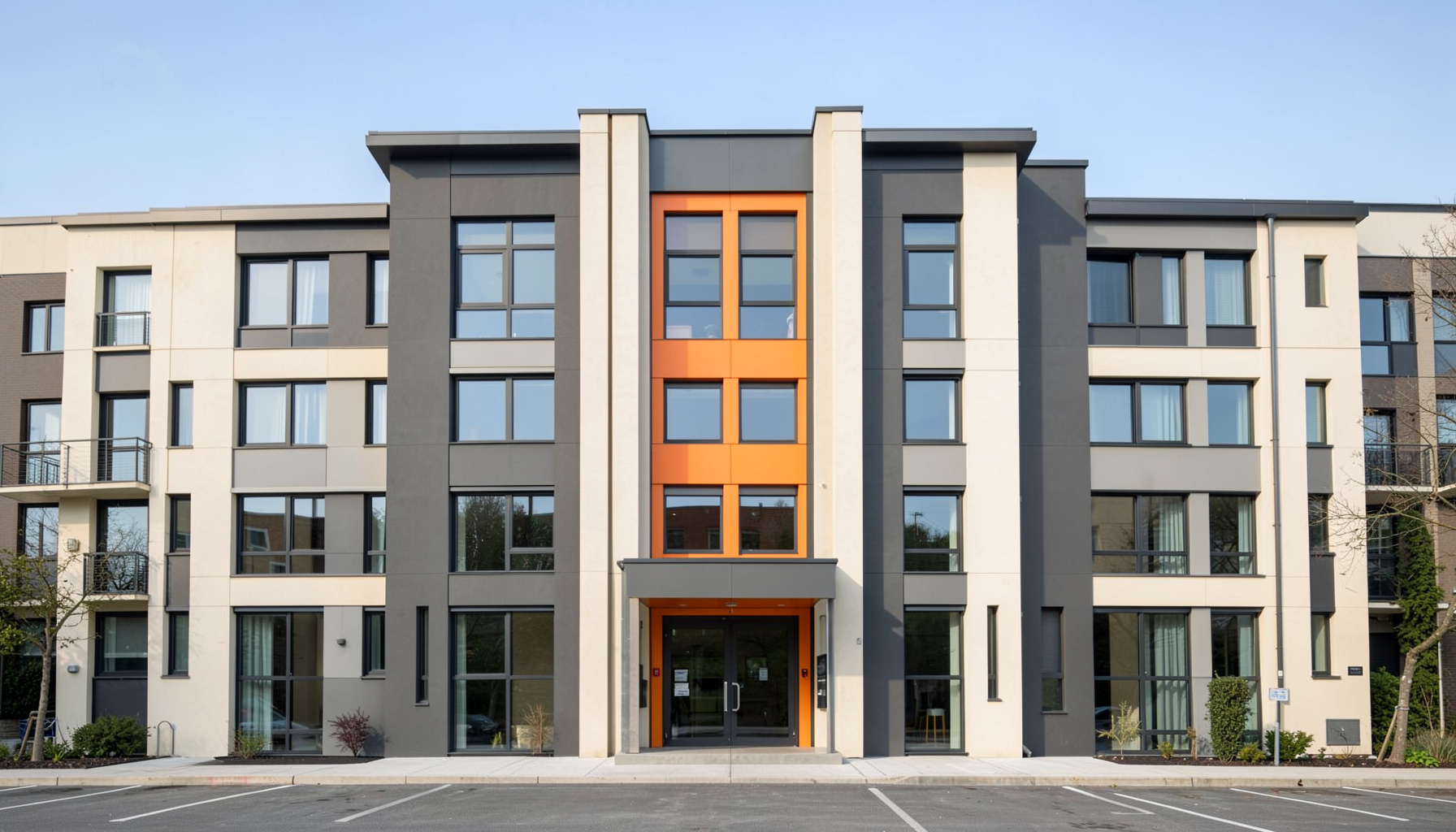 A symmetrical view of a community office building facade, charcoal and cream tones, professional and calm mood